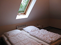 Schlafzimmer Dachgeschoss Wenkendorf Ferienwohnung Mellenthin